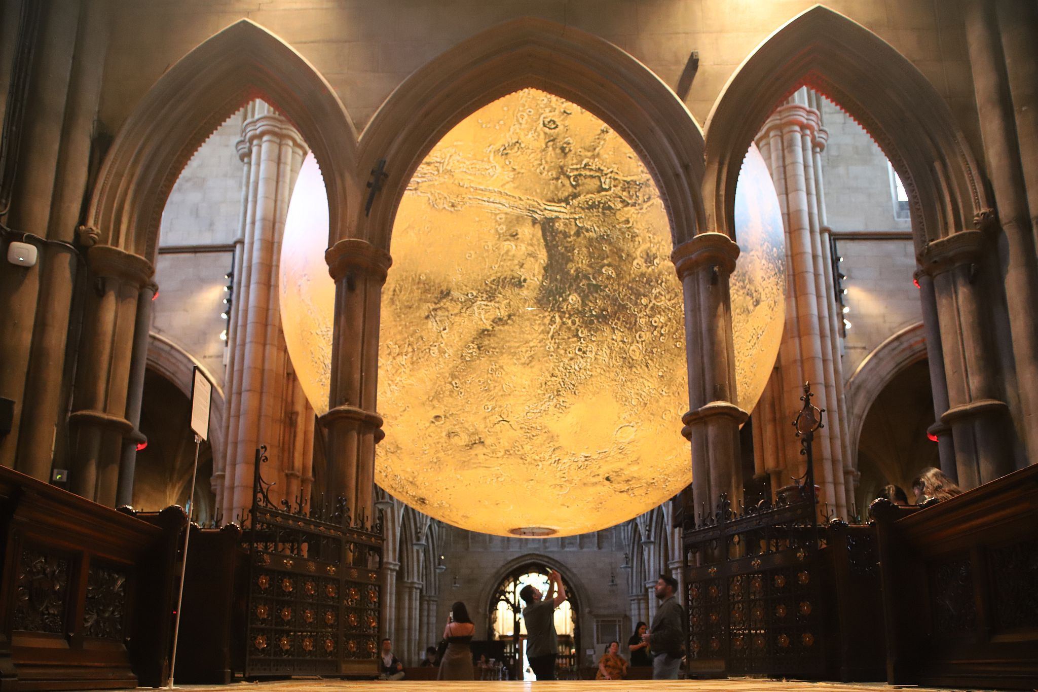 Luke Jerram's "Mars: War & Peace" hosted by the Kensington and Chelsea Festival at St John the Baptist Church in Holland Road, West London.