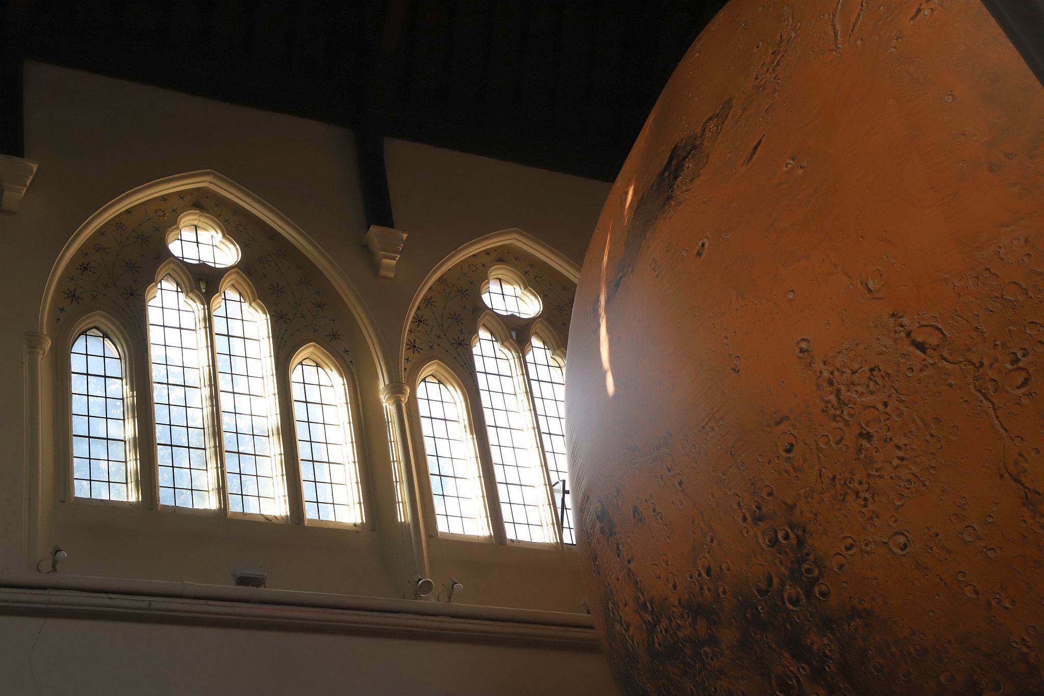 Luke Jerram's “Mars: War and Peace" at All Saints’ Church, Notting Hill, London on 01-Aug-2023. Presented by the Kensington and Chelsea Festival. https://bryan-jones.com