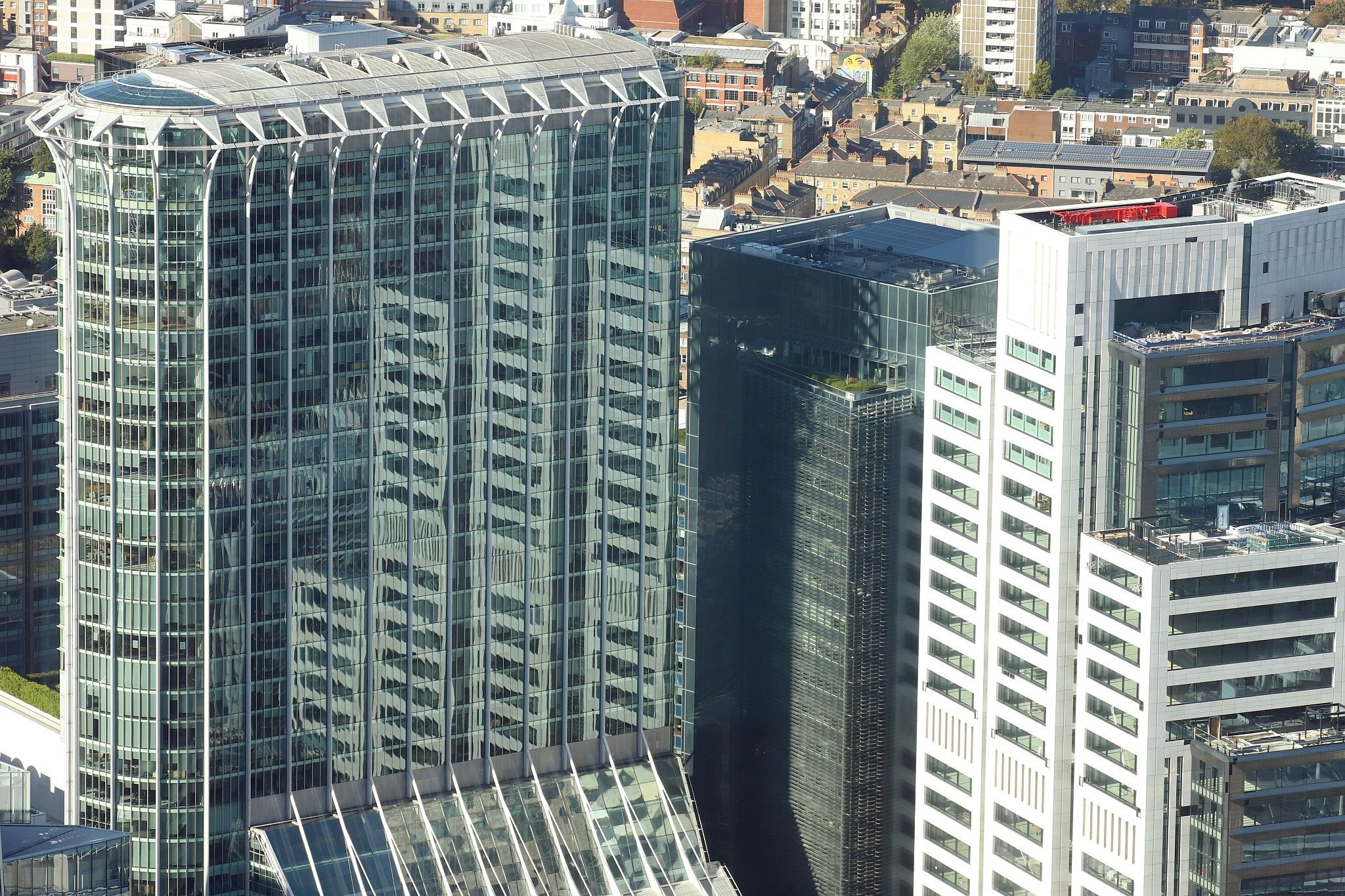 Aerial view of office buildings reflecting in the Citypoint Tower, City of London. View from the Horizon observation platform on the 58th floor of 22 Bishopsgate in the City of London. Photo taken on 15-Oct-2023.