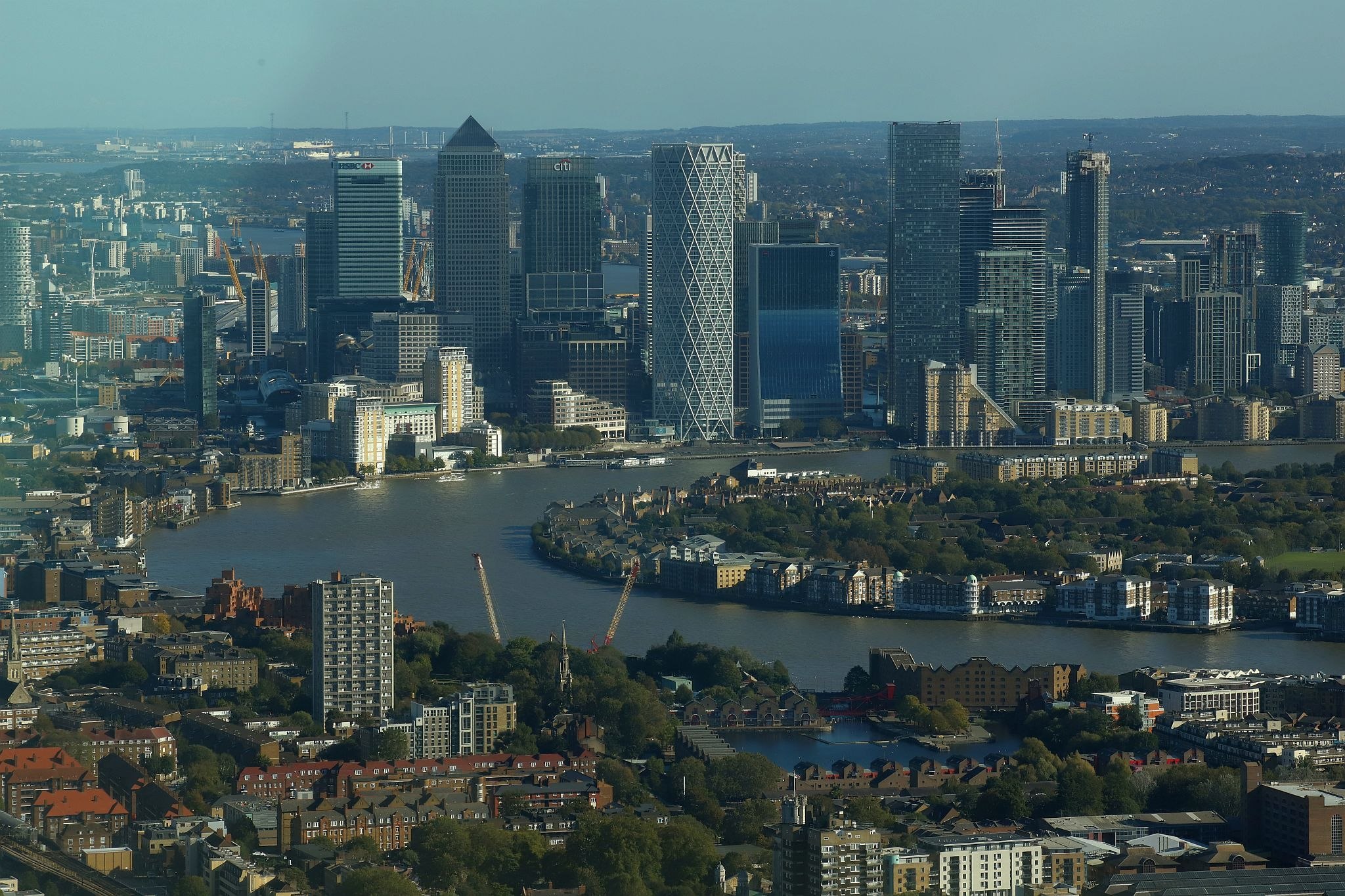 Aerial view of Canary Wharf's towers and skyscrapers with Rotherhithe and Wapping in London. View from the Horizon observation platform on the 58th floor of 22 Bishopsgate in the City of London. Photo taken on 15-Oct-2023.