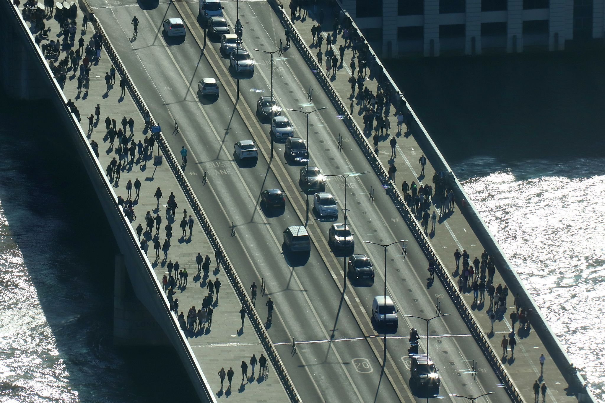 Aerial view of London Bridge in a low sun creating lots of long shadows. View from the Horizon observation platform on the 58th floor of 22 Bishopsgate in the City of London. Photo taken on 15-Oct-2023.