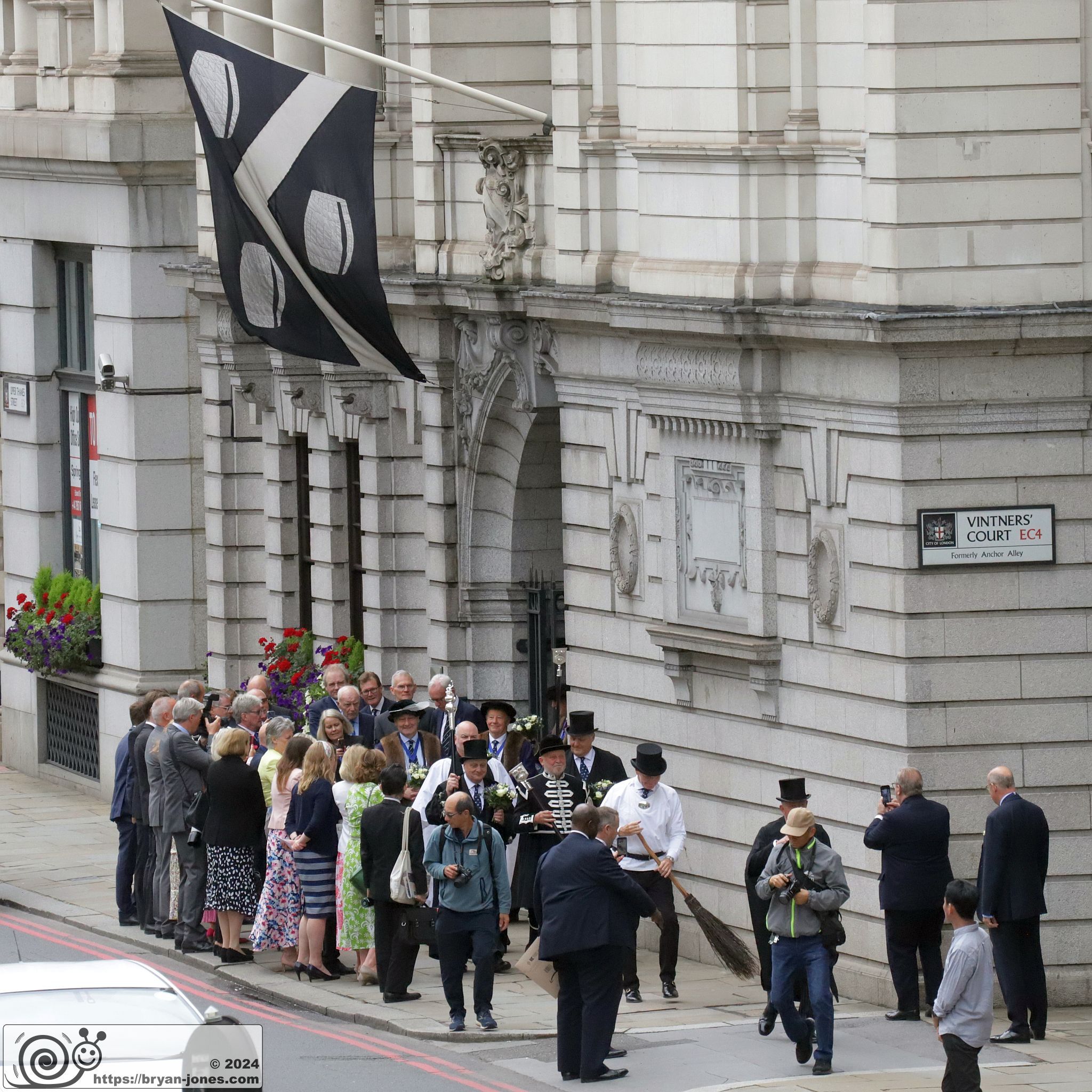2024 annual Vintners' company procession to St James Garlickhythe church following the installation of the new Master. Led by a sweeper. 10-Jul-2024.