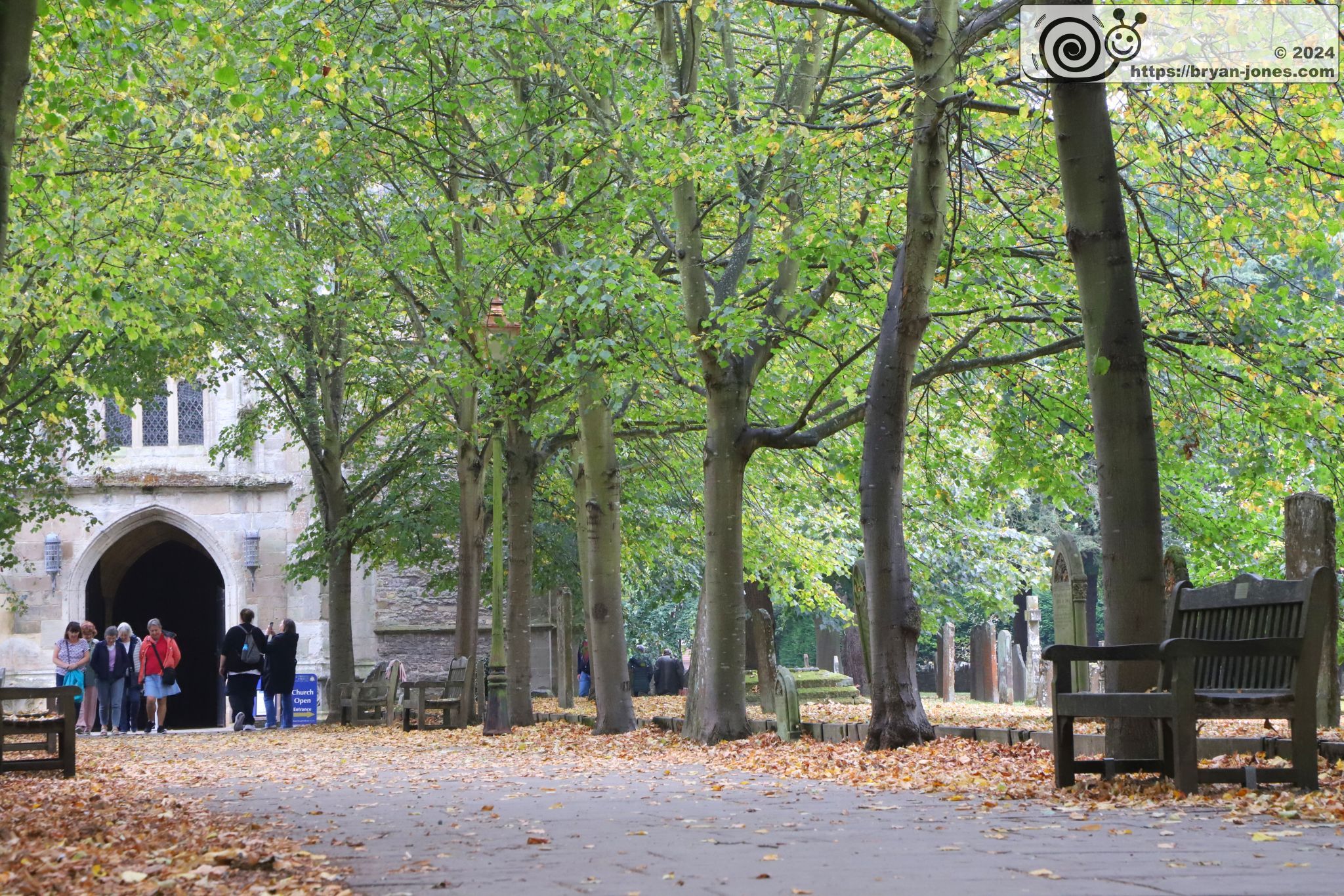 Path leading to church with Autumn leaves
