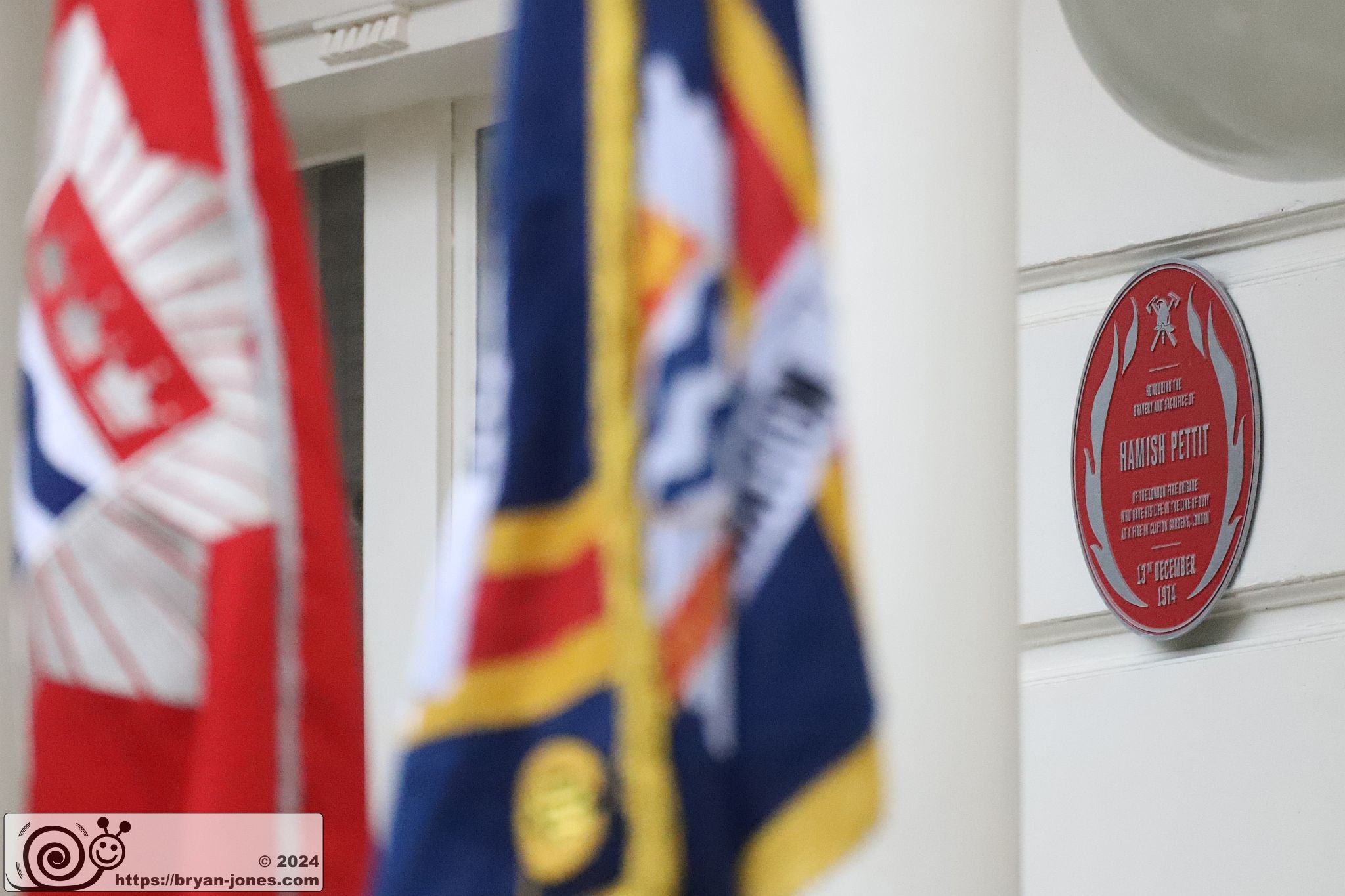 Brigade standards in front of the FBU red plaque. 14-Dec-2024