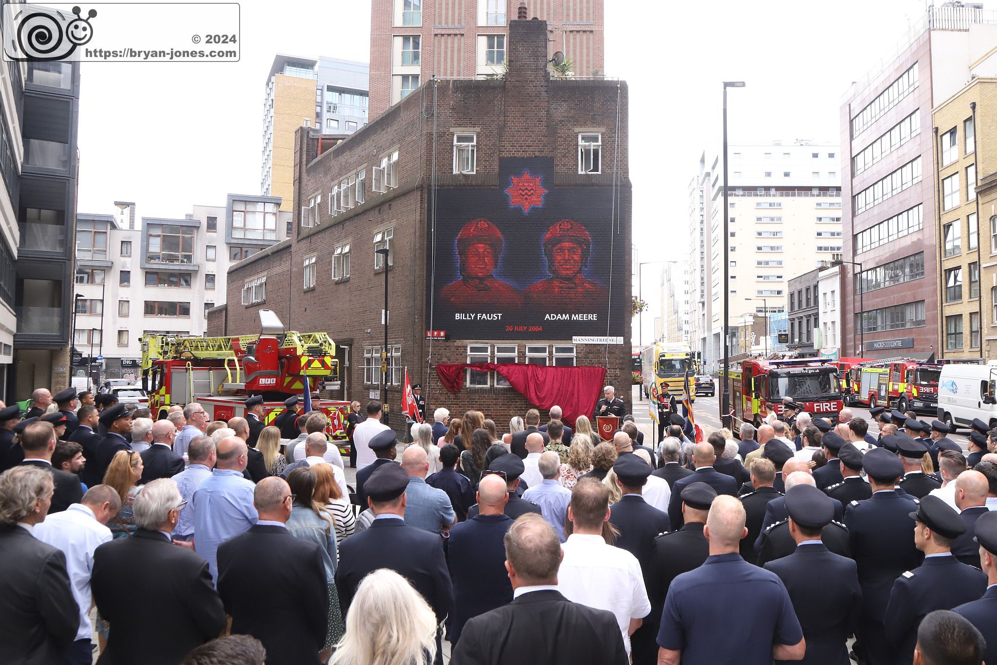 London Fire Brigade 20th anniversary memorial service for Billy Faust and Adam Meere. Unveiling of mural at Whitechapel fire station painted by artist David Speed. 20-Jul-2024.