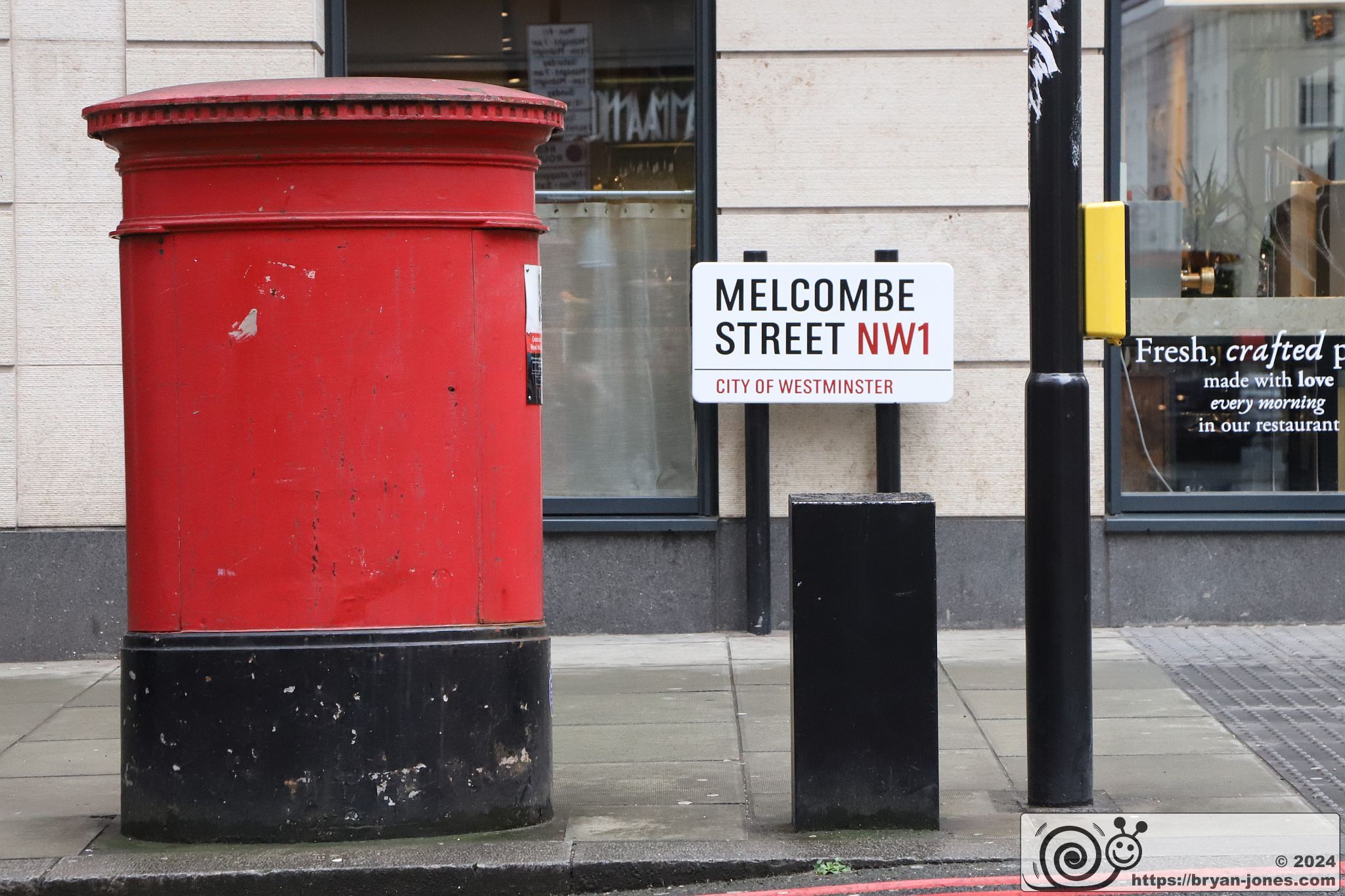Danger Mouse blue plaque at the junction of Baker Street and Melcombe Street. The smallest blue plaque in London is on a postbox in which the children's cartoon secret agent lived.