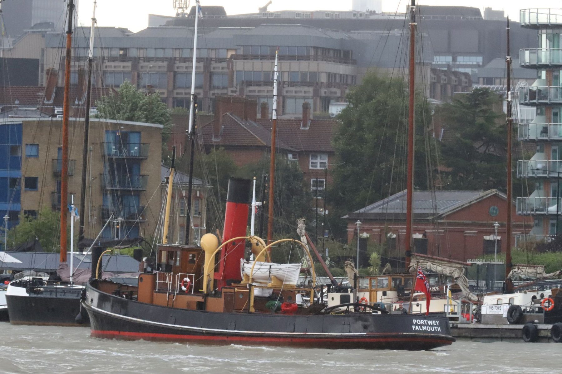 Steam Tug Portwey passes Hermitage Moorings, Wapping on the River Thames, 08-Sep-2022