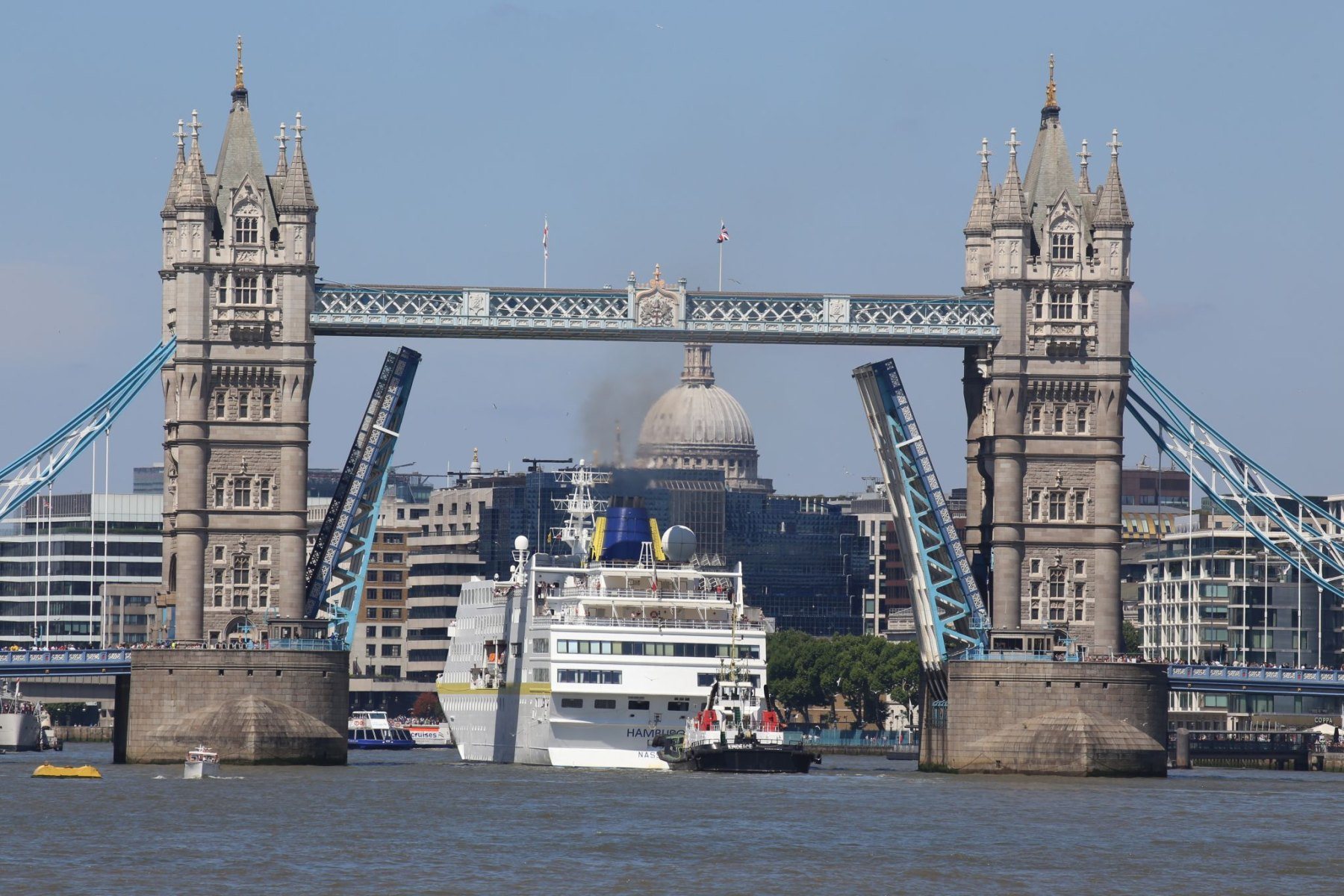 Cruise ship Hamburg passing through Tower Bridge at the start of a London visit, 10-Jul-2022.