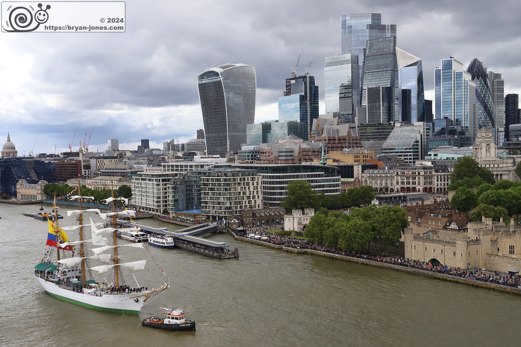 Tall ship ARC Gloria, flagship of the Colombian Navy, on the River Thames in the Pool of London with the City of London behind. 06-Jul-2024.