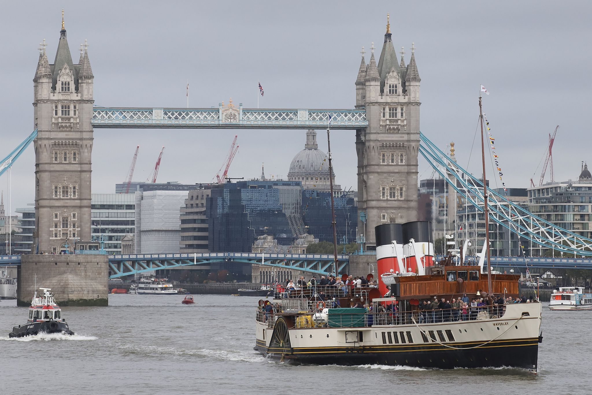 Paddle Steamer Waverley sails down the River Thames towards the sea. 24-Sep-2023. Tower Bridge in the background.