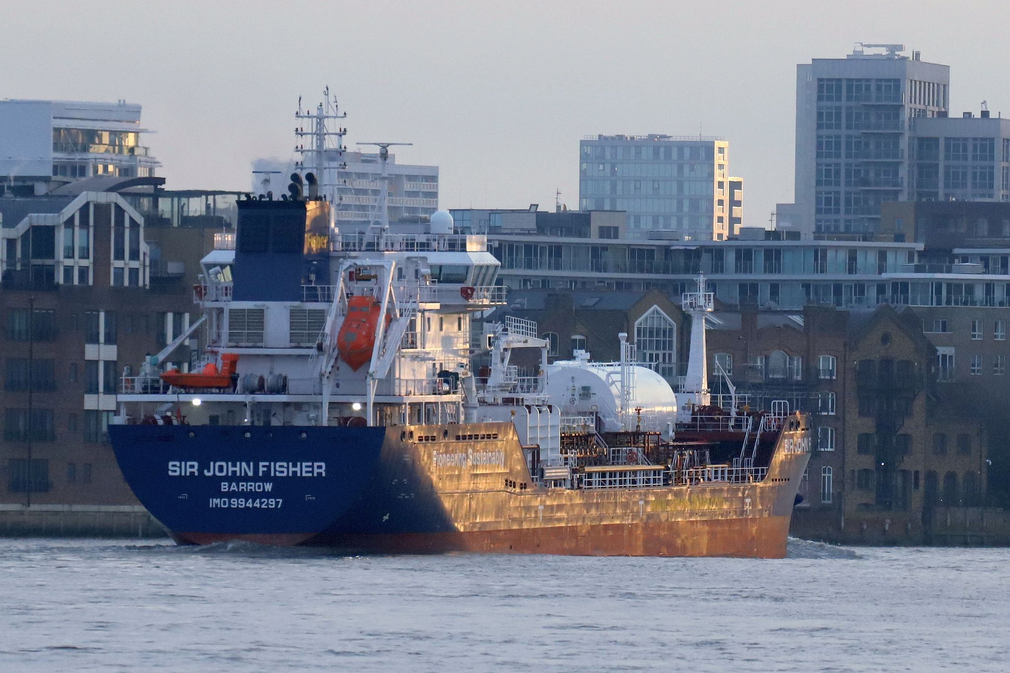 Chemical Tanker “Sir John Fisher”, owned by James Fisher, leaves central London on 29-Mar-2023 and passes downstream on the River Thames.
