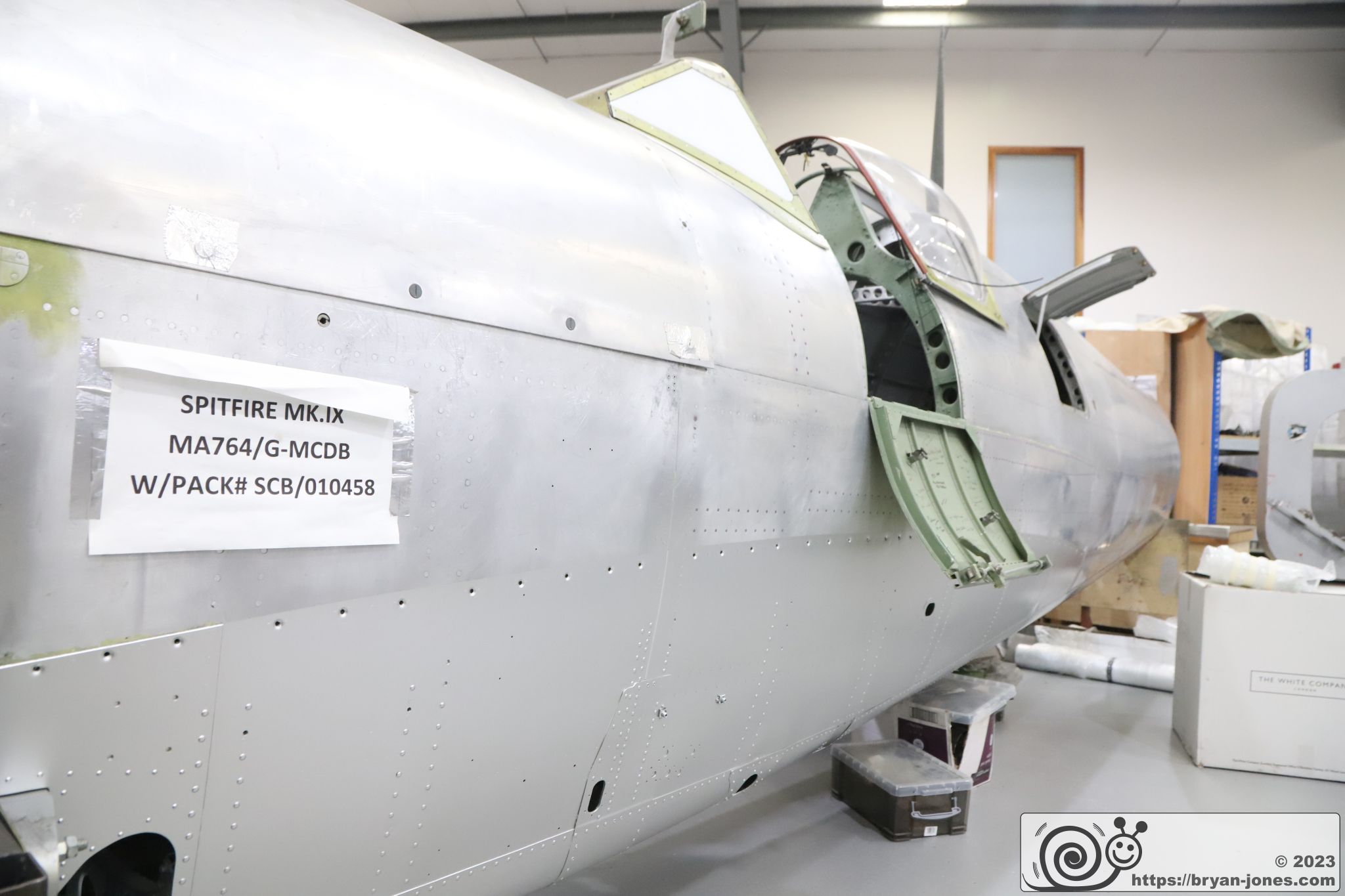 Bare metal of Spitfire Mk IX MA764 with panel signed by pilots