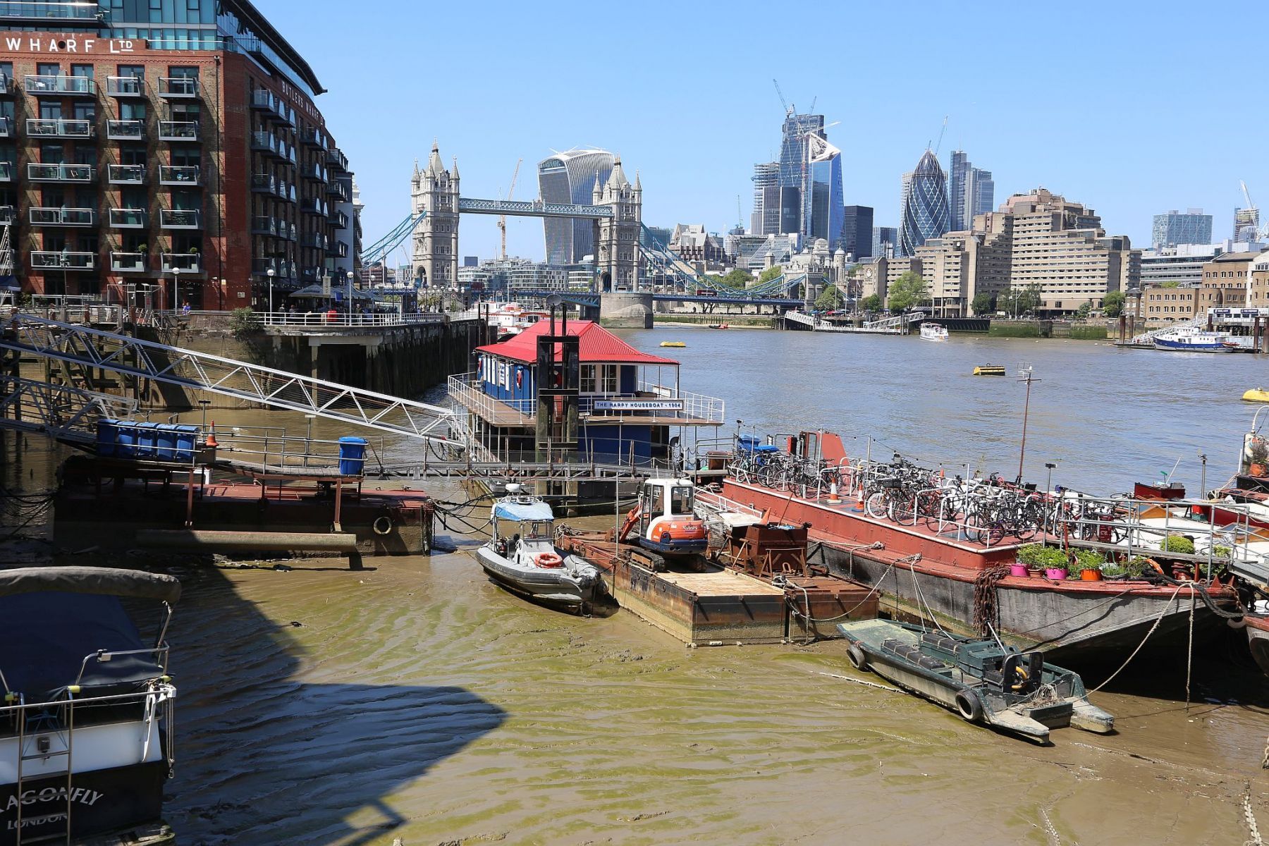 Houseboats and gardens at Tower Bridge moorings on the River Thames in London. Taken on 19-May-2018 during London Open Gardens Weekend. House boat.