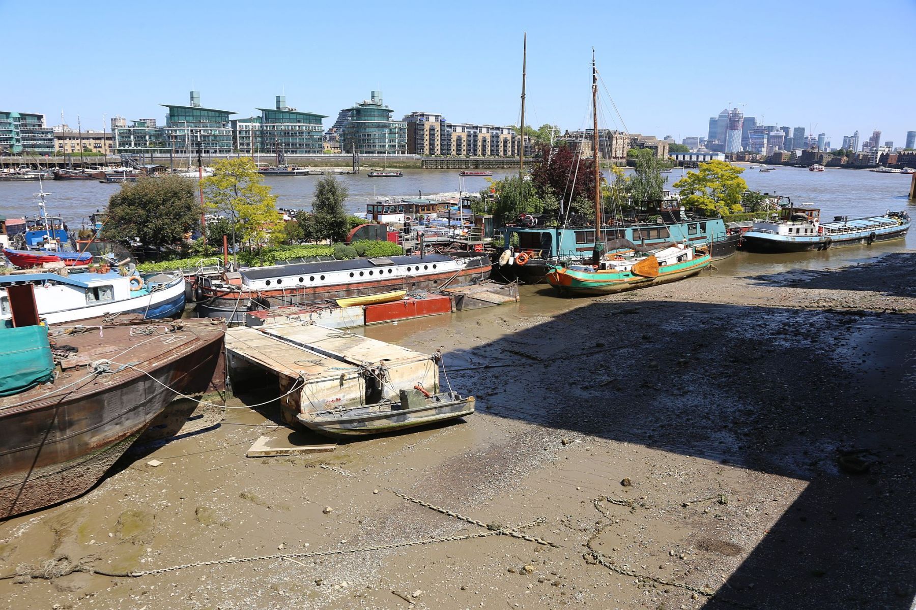 Houseboats and gardens at Tower Bridge moorings on the River Thames in London. Taken on 19-May-2018 during London Open Gardens Weekend. House boat.