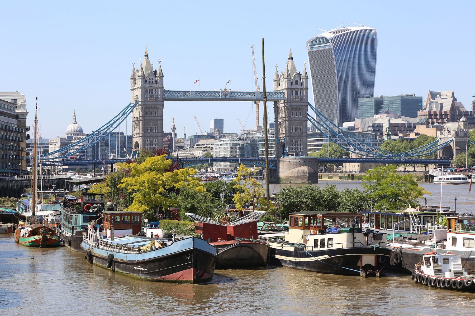Houseboats and gardens at Tower Bridge moorings on the River Thames in London. Taken on 19-May-2018 during London Open Gardens Weekend. House boat.