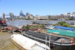 Houseboats and gardens at Tower Bridge moorings on the River Thames in London. Taken on 19-May-2018 during London Open Gardens Weekend. House boat.