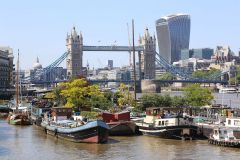 Houseboats and gardens at Tower Bridge moorings on the River Thames in London. Taken on 19-May-2018 during London Open Gardens Weekend. House boat.