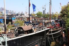 Houseboats and gardens at Tower Bridge moorings on the River Thames in London. Taken on 19-May-2018 during London Open Gardens Weekend. House boat.