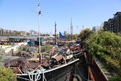 Houseboats and gardens at Tower Bridge moorings on the River Thames in London. Taken on 19-May-2018 during London Open Gardens Weekend. House boat.