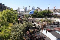 Houseboats and gardens at Tower Bridge moorings on the River Thames in London. Taken on 19-May-2018 during London Open Gardens Weekend. House boat.