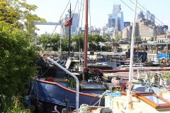 Houseboats and gardens at Tower Bridge moorings on the River Thames in London. Taken on 19-May-2018 during London Open Gardens Weekend. House boat.