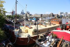 Houseboats and gardens at Tower Bridge moorings on the River Thames in London. Taken on 19-May-2018 during London Open Gardens Weekend. House boat.