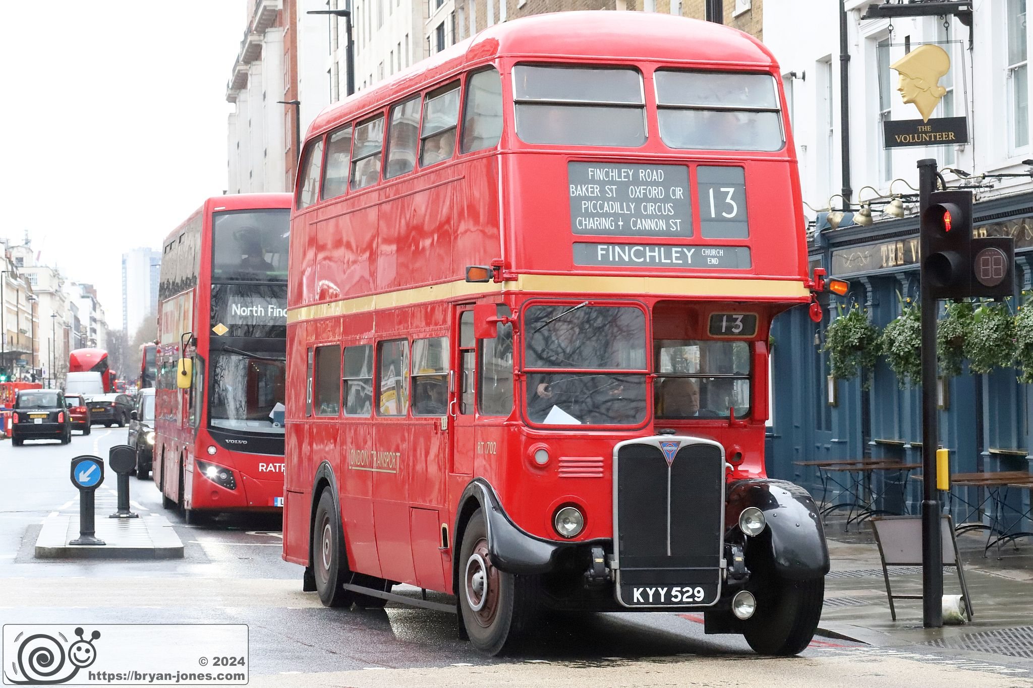 KYY529, RT1702. Vintage preserved London double decker RT bus heading North turning left from Baker Street, London into Park Road running a service on 10-Mar-2024.