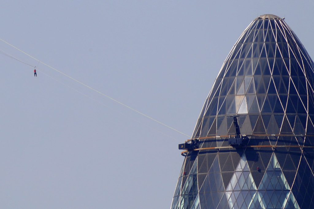 A participant slides down the zipwire between The Cheesegrater and The Gherkin in the City of London on 09-Sep-2023.